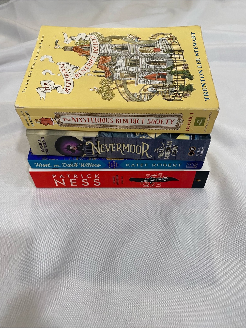 Stack of Four Young Adult Paperback Books - Yellow, Purple, Blue, Red Covers